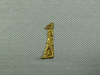  <em>Anubis Amulet</em>, 664–30 B.C.E. Gold, 1 1/8 x 7/16 x 1/16 in. (2.8 x 1.1 x 0.1 cm). Brooklyn Museum, Charles Edwin Wilbour Fund, 08.480.219. Creative Commons-BY (Photo: Brooklyn Museum, CUR.08.480.219.jpg)