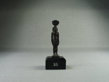  <em>Standing Figure of Isis</em>. Bronze, 2 7/16 x 1/2 x 1/2 in. (6.2 x 1.3 x 1.2 cm). Brooklyn Museum, Charles Edwin Wilbour Fund, 08.480.228. Creative Commons-BY (Photo: Brooklyn Museum, CUR.08.480.228_view1.jpg)