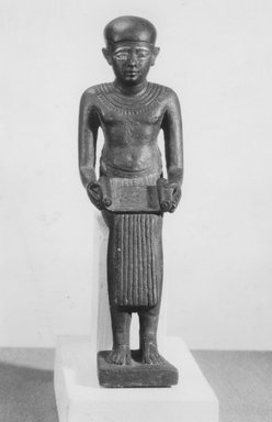  <em>Seated Statuette of Imhotep</em>, ca. 664-30 B.C.E. Bronze, gold, 5 3/16 x 1 9/16 in. (13.2 x 3.9 cm). Brooklyn Museum, Charles Edwin Wilbour Fund, 08.480.24. Creative Commons-BY (Photo: Brooklyn Museum, CUR.08.480.24_front_negA_bw.jpg)