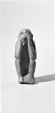  <em>Figurine of a Seated Monkey</em>, ca. 1550-1070 B.C.E. or 664-525 B.C.E. Faience, 3 1/16 x 1 1/4 in. (7.8 x 3.2 cm). Brooklyn Museum, Charles Edwin Wilbour Fund, 08.480.74. Creative Commons-BY (Photo: Brooklyn Museum, CUR.08.480.74_NegD_bw.jpg)