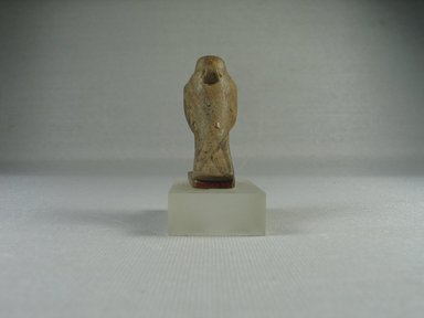  <em>Figure of a Horus Falcon</em>. Limestone (probably), 1 7/8 x 13/16 x 1 3/8 in. (4.8 x 2.1 x 3.5 cm). Brooklyn Museum, Charles Edwin Wilbour Fund, 08.480.75. Creative Commons-BY (Photo: Brooklyn Museum, CUR.08.480.75_view3.jpg)