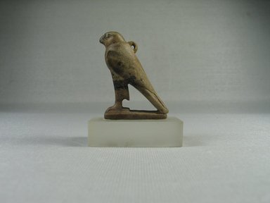  <em>Figure of a Horus Falcon</em>. Limestone (probably), 1 7/8 x 13/16 x 1 3/8 in. (4.8 x 2.1 x 3.5 cm). Brooklyn Museum, Charles Edwin Wilbour Fund, 08.480.75. Creative Commons-BY (Photo: Brooklyn Museum, CUR.08.480.75_view4.jpg)
