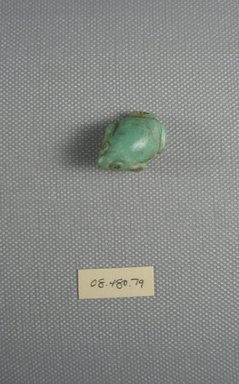  <em>Figure of Frog</em>. Feldspar, 1/2 in. (1.2 cm). Brooklyn Museum, Charles Edwin Wilbour Fund, 08.480.79. Creative Commons-BY (Photo: Brooklyn Museum, CUR.08.480.79_View3.jpg)