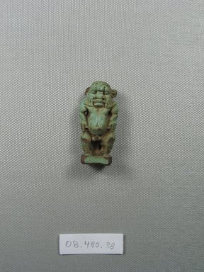  <em>Small Figure of Bes</em>, 664-31 B.C.E. Faience, 1 3/4 × 7/8 × 9/16 in. (4.5 × 2.2 × 1.4 cm). Brooklyn Museum, Charles Edwin Wilbour Fund, 08.480.88. Creative Commons-BY (Photo: Brooklyn Museum, CUR.08.480.88_front.jpg)