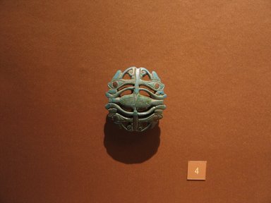  <em>Wadjet-Eyes and Papyrus Stalks</em>, ca. 945-718 B.C.E. or later. Faience, 2 1/4 x 2 3/8 in. (5.7 x 6.1 cm). Brooklyn Museum, Charles Edwin Wilbour Fund, 08.480.93. Creative Commons-BY (Photo: Brooklyn Museum, CUR.08.480.93_mummychamber.jpg)