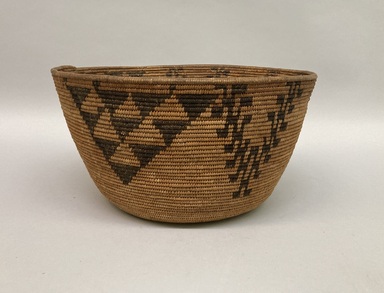 Amanda Wilson (Maidu, ca. 1860-1946). <em>Coiled Cooking Basket (Bush-ka) with "Valley-Quail Topknot" (Shu-shu) and "Grape Leaves" (Ba-hu) Patterns</em>, 1860-1909. Sedge root, briar root, willow shoot (?), 6 7/8 × 13 5/16 × 13 1/4 in. (17.5 × 33.8 × 33.7 cm). Brooklyn Museum, Museum Expedition 1908, Museum Collection Fund, 08.491.8679. Creative Commons-BY (Photo: Brooklyn Museum, CUR.08.491.8679.jpg)
