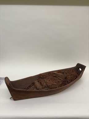 Coast Salish. <em>Cradle</em>, late 19th century. Wood, cedar bark shavings, fiber, (92.5 x 34.5 x 18.0 cm). Brooklyn Museum, Museum Expedition 1908, Museum Collection Fund, 08.491.8909. Creative Commons-BY (Photo: Brooklyn Museum photgoraph, CUR.08.491.8909_overall.jpg)