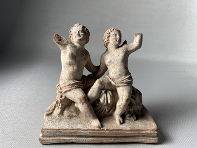 Possibly Greek. <em>Two Little Loves</em>. Terracotta, pigment, 4 1/8 × 2 1/16 × 4 9/16 in. (10.5 × 5.2 × 11.6 cm). Brooklyn Museum, Gift of A. Augustus Healy, 09.19. Creative Commons-BY (Photo: Brooklyn Museum, CUR.09.19_view01.jpeg)