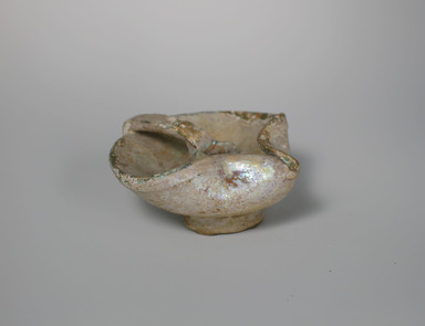  <em>Small Oil Lamp</em>, 12th-13th century. ceramic, fritware, 2 1/8 x 4 7/8 x 4 5/8 in. (5.4 x 12.4 x 11.7 cm). Brooklyn Museum, Gift of Robert B. Woodward, 09.312. Creative Commons-BY (Photo: Brooklyn Museum, CUR.09.312.jpg)