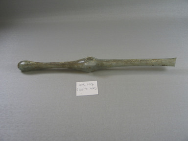Roman. <em>Spindle-Form Unguentarium</em>, 4th century C.E. Glass, 1 1/16 x greatest length 11 7/8 in. (2.7 x 30.2 cm). Brooklyn Museum, Gift of Robert B. Woodward, 09.793. Creative Commons-BY (Photo: Brooklyn Museum, CUR.09.793.jpg)