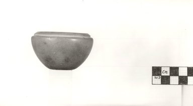  <em>Deep Cup</em>. Limestone, 2 3/4 x Greatest Diam. 1 11/16 in. (7 x 4.3 cm). Brooklyn Museum, Charles Edwin Wilbour Fund, 09.889.21. Creative Commons-BY (Photo: Brooklyn Museum, CUR.09.889.21_NegA_print_bw.jpg)
