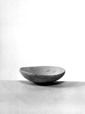  <em>Small Flat Cup</em>, ca. 2675-2170 B.C.E. Limestone, 11/16 x Greatest Diam. 2 5/16 in. (1.7 x 5.8 cm). Brooklyn Museum, Charles Edwin Wilbour Fund, 09.889.28. Creative Commons-BY (Photo: , CUR.09.889.28_NegA_print_bw.jpg)