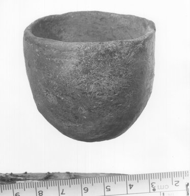  <em>Cup</em>. Terracotta, Height 2 1/4 in. (5.7 cm), or 2 1/8 in. (5.4 cm). Brooklyn Museum, Charles Edwin Wilbour Fund, 09.889.451. Creative Commons-BY (Photo: Brooklyn Museum, CUR.09.889.451_NegB_print_bw.jpg)