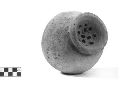  <em>Globular Shaped Strainer</em>. Terracotta, pigment, Height: 6 in. (15.3 cm). Brooklyn Museum, Charles Edwin Wilbour Fund, 09.889.653. Creative Commons-BY (Photo: Brooklyn Museum, CUR.09.889.653_NegA_print_bw.jpg)