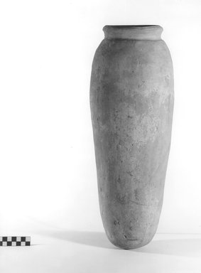  <em>Storage Pot</em>. Terracotta, 19 3/16 x 6 3/16 in. (48.8 x 15.7 cm). Brooklyn Museum, Charles Edwin Wilbour Fund, 09.889.735. Creative Commons-BY (Photo: Brooklyn Museum, CUR.09.889.735_NegA_print_bw.jpg)
