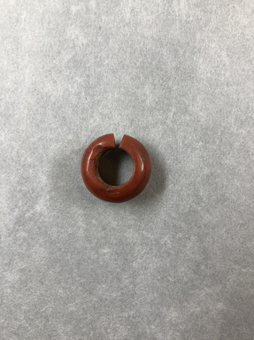  <em>Penannular Earring or Hair Ring</em>. Carnelian, depth: 1/4 in. (0.6 cm). Brooklyn Museum, Charles Edwin Wilbour Fund, 09.889.839.1. Creative Commons-BY (Photo: , CUR.09.889.839.1_view01.jpg)
