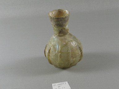 Roman. <em>Sprinkler with Vertical Ribs</em>, 1st–early8th century C.E. Glass, 3 5/16 x diam. 2 7/16 in. (8.4 x 6.2 cm). Brooklyn Museum, Gift of Robert B. Woodward, 11.14. Creative Commons-BY (Photo: Brooklyn Museum, CUR.11.14_view2.jpg)