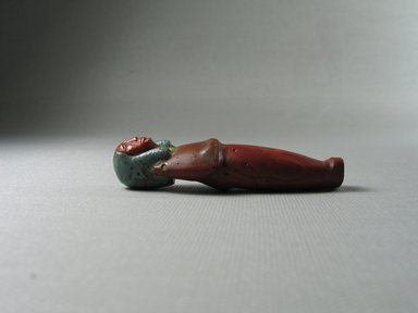 <em>Red and Blue Standing Mummiform Figure</em>. Glass, 2 7/8 × 3/4 in. (7.3 × 1.9 cm). Brooklyn Museum, Museum Collection Fund, 11.683. Creative Commons-BY (Photo: Brooklyn Museum, CUR.11.683_view2.jpg)