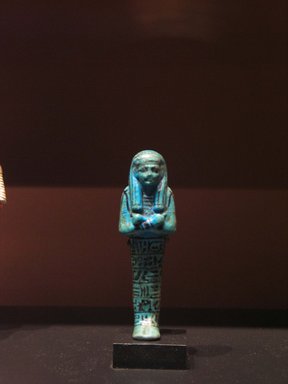  <em>Shabty of Seti I</em>, ca. 1290-1279 B.C.E. Faience, 5 5/8 x 1 3/4 in. (14.3 x 4.5 cm). Brooklyn Museum, Museum Collection Fund, 11.686. Creative Commons-BY (Photo: Brooklyn Museum, CUR.11.686_mummychamber.jpg)