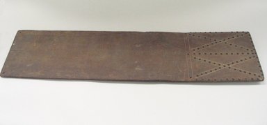 Osage. <em>Cradle Board</em>, late 19th–early 20th century. Walnut, brass tacks, 10 x 41 in. (25.4 x 104.1 cm). Brooklyn Museum, Museum Expedition 1911, Museum Collection Fund, 11.694.9007. Creative Commons-BY (Photo: Brooklyn Museum, CUR.11.694.9007_view1.jpg)