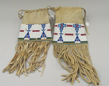 Osage, Cheyenne. <em>Pair of Bags</em>, late 19th–early 20th century. Beads, hide, 17 11/16 x 6 1/2in. (45 x 16.5cm). Brooklyn Museum, Museum Expedition 1911, Museum Collection Fund, 11.694.9026. Creative Commons-BY (Photo: Brooklyn Museum, CUR.11.694.9026_view1.jpg)