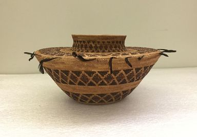 Yokuts. <em>Bottleneck Basket</em>, late 19th-early 20th century. Deer-grass, sedge root, bracken root, redbud, quail topknot feathers, 4 3/4 x 9 13/16 in.  (12.0 x 25.0 cm). Brooklyn Museum, Museum Expedition 1911, Museum Collection Fund, 11.694.9242. Creative Commons-BY (Photo: , CUR.11.694.9242_view01.jpg)