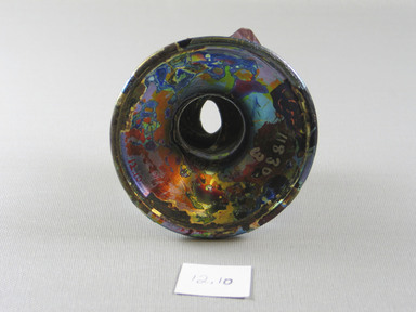 Roman. <em>Foot of Large Base of Molded Glass</em>, 3rd-7th century C.E. Glass, 2 3/4 x Diam. 3 3/4 in. (7 x 9.6 cm). Brooklyn Museum, Purchased with funds given by Robert B. Woodward, 12.10. Creative Commons-BY (Photo: Brooklyn Museum, CUR.12.10_bottom.jpg)
