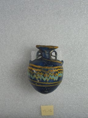 Greek. <em>Aryballos</em>, late 6th-early 4th century B.C.E. Glass, 2 5/8 × Diam. 2 in. (6.7 × 5.1 cm). Brooklyn Museum, Purchased with funds given by Robert B. Woodward, 12.12. Creative Commons-BY (Photo: Brooklyn Museum, CUR.12.12_side1.jpg)