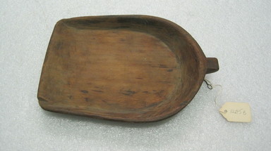 Ainu. <em>Soft Bowl with Small Handle</em>. Wood, 5 11/16 x 8 1/16 in. (14.5 x 20.5 cm). Brooklyn Museum, Gift of Herman Stutzer, 12.145b. Creative Commons-BY (Photo: , CUR.12.145b.jpg)
