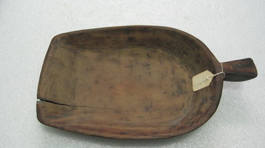 Ainu. <em>Soft Bowl with Handle</em>. Wood, 5 13/16 x 11 7/8 in. (14.7 x 30.2 cm). Brooklyn Museum, Gift of Herman Stutzer, 12.145d. Creative Commons-BY (Photo: , CUR.12.145d.jpg)