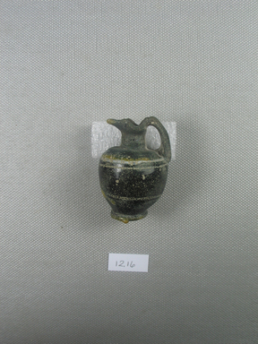  <em>Ewer</em>, late 4th-early 3rd century B.C.E. Glass, 2 x Diam. 1 3/8 in. (5.1 x 3.5 cm). Brooklyn Museum, Purchased with funds given by Robert B. Woodward, 12.16. Creative Commons-BY (Photo: Brooklyn Museum, CUR.12.16_side2.jpg)