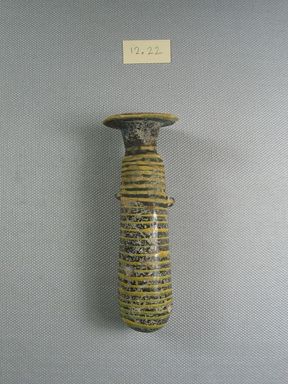  <em>Cylindrical Alabastron</em>, mid 4th-late 3rd century B.C.E. Glass, 4 1/4 x Diam. 1 1/16 in. (10.8 x 2.7 cm). Brooklyn Museum, Purchased with funds given by Robert B. Woodward, 12.22. Creative Commons-BY (Photo: Brooklyn Museum, CUR.12.22_side1.jpg)