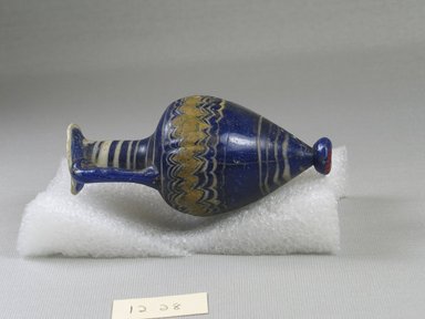  <em>Amphora</em>, 5th century B.C.E. Glass, 4 5/16 x Diam. 2 in. (10.9 x 5.1 cm). Brooklyn Museum, Purchased with funds given by Robert B. Woodward, 12.28. Creative Commons-BY (Photo: Brooklyn Museum, CUR.12.28_back.jpg)