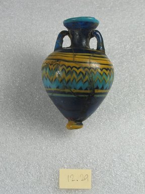  <em>Amphora</em>, 5th century B.C.E. Glass, 2 13/16 x Diam. 1 3/4 in. (7.2 x 4.4 cm). Brooklyn Museum, Purchased with funds given by Robert B. Woodward, 12.29. Creative Commons-BY (Photo: Brooklyn Museum, CUR.12.29_side1.jpg)