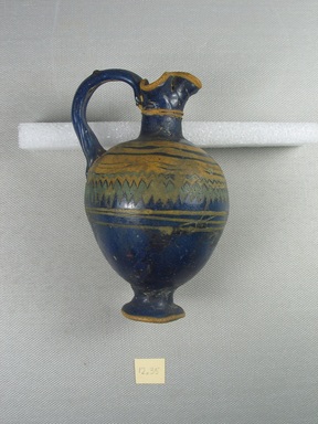  <em>Big Body Vessel</em>, 5th century B.C.E. Glass, 4 13/16 x 3 9/16 x 2 3/4 in. (12.3 x 9 x 7 cm). Brooklyn Museum, Purchased with funds given by Robert B. Woodward, 12.35. Creative Commons-BY (Photo: Brooklyn Museum, CUR.12.35_side1.jpg)