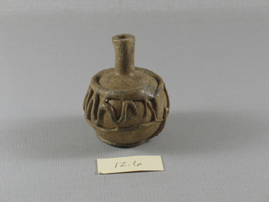 Islamic. <em>Bottle of Blown Glass</em>, 7th-8th century C.E. Glass, 2 7/16 x Diam. 2 in. (6.2 x 5.1 cm). Brooklyn Museum, Gift of Aziz Khayat, 12.6. Creative Commons-BY (Photo: Brooklyn Museum, CUR.12.6_view2.jpg)