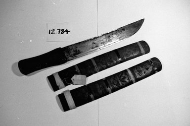 Ainu. <em>Modern Scabbard and Knife</em>. Metal, bamboo, 2 3/16 x 17 11/16 in. (5.5 x 45 cm). Brooklyn Museum, Gift of Herman Stutzer, 12.784. Creative Commons-BY (Photo: Brooklyn Museum, CUR.12.784_bw.jpg)