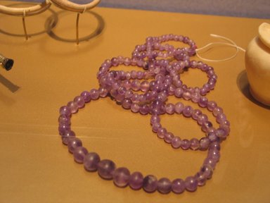  <em>Necklace</em>, ca. 1938-1700 B.C.E. Amethyst, Length: 22 1/2 in. (57.2 cm). Brooklyn Museum, Gift of the Egypt Exploration Fund, 13.1025. Creative Commons-BY (Photo: Brooklyn Museum, CUR.13.1025_erg2.jpg)
