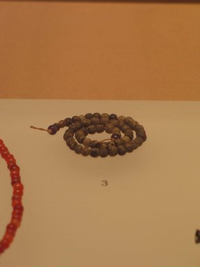  <em>Necklace</em>, ca. 1938-1700 B.C.E. Amethyst, unidentified stone, 13 1/4 in. (33.7 cm). Brooklyn Museum, Gift of the Egypt Exploration Fund, 13.1027. Creative Commons-BY (Photo: Brooklyn Museum, CUR.13.1027_mummychamber.jpg)