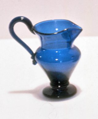  <em>Blue Glass Pitcher</em>, ca. 1750–1810. Glass, 4 x 2 1/2 in. (10.2 x 6.4 cm). Brooklyn Museum, Purchased by Special Subscription and Museum Collection Fund, 13.957. Creative Commons-BY (Photo: Brooklyn Museum, CUR.13.957.jpg)