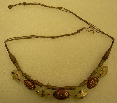  <em>Necklace</em>, 19th century. Gold, nephrite, gem stone, ruby, diamond, strings, 24 in. (61 cm). Brooklyn Museum, Bequest of Robert B. Woodward, 14.436. Creative Commons-BY (Photo: Brooklyn Museum, CUR.14.436.jpg)