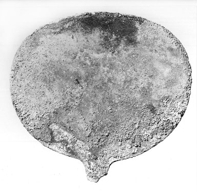  <em>Mirror Disk</em>, ca. 1539–1292 B.C.E. Bronze, linen, 4 3/4 × 4 13/16 in. (12.1 × 12.3 cm). Brooklyn Museum, Gift of the Egypt Exploration Fund, 14.619. Creative Commons-BY (Photo: Brooklyn Museum, CUR.14.619_NegA_print_bw.jpg)
