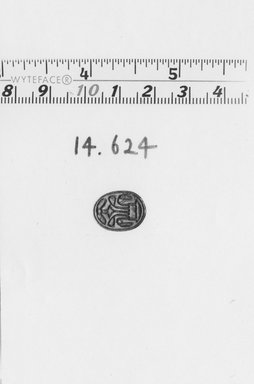  <em>Scarab with Winged Disk and Lotus</em>, ca. 1539-1292 B.C.E. Faience or steatite, 1/4 x 7/16 x 5/8 in. (0.7 x 1.1 x 1.6 cm). Brooklyn Museum, Gift of the Egypt Exploration Fund, 14.624. Creative Commons-BY (Photo: Brooklyn Museum, CUR.14.624_NegA_print_bw.jpg)