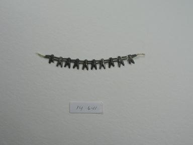  <em>Fly Necklace</em>, ca. 1539-1292 B.C.E. Silver, 1/2 x 4 1/4 in. (1.2 x 10.8 cm). Brooklyn Museum, Gift of the Egypt Exploration Fund, 14.641. Creative Commons-BY (Photo: Brooklyn Museum, CUR.14.641_overall.jpg)