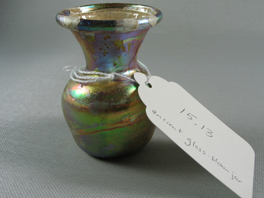 Roman. <em>Vase</em>, 1st-2nd century C.E. Glass, 2 13/16 x Diam. 2 1/16 in. (7.2 x 5.3 cm). Brooklyn Museum, Bequest of Robert B. Woodward, 15.13. Creative Commons-BY (Photo: Brooklyn Museum, CUR.15.13.jpg)