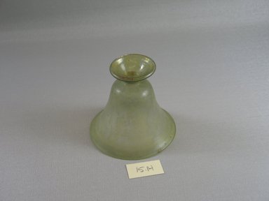 Roman. <em>Bell-shaped Vase</em>, 1st century B.C.E. Glass, 3 1/8 x Diam. 3 1/4 in. (8 x 8.3 cm). Brooklyn Museum, Gift of Robert B. Woodward, 15.14. Creative Commons-BY (Photo: Brooklyn Museum, CUR.15.14_bottom.jpg)