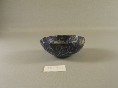Roman. <em>Mosaic Bowl</em>, 1st century B.C.E.–early 1st century C.E. Glass, 1 3/8 × Diam. 3 1/2 in. (3.5 × 8.9 cm). Brooklyn Museum, Bequest of Robert B. Woodward, 15.262. Creative Commons-BY (Photo: Brooklyn Museum, CUR.15.262_view2.jpg)