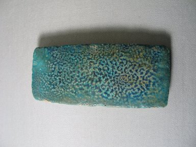  <em>Tile</em>. Faience, 2 9/16 × 11/16 × 6 1/8 in. (6.5 × 1.7 × 15.5 cm). Brooklyn Museum, Gift of the Egypt Exploration Fund, 15.497. Creative Commons-BY (Photo: , CUR.15.497_view01.jpg)