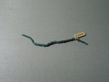  <em>Single Strand Necklace</em>. Faience, 3/16 × 4 15/16 in. (0.4 × 12.6 cm). Brooklyn Museum, Gift of the Egypt Exploration Fund, 15.499. Creative Commons-BY (Photo: , CUR.15.499_view01.jpg)