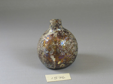 Roman. <em>Bottle</em>, 1st-12th century C.E. Glass, 2 7/16 x greatest diam. 2 1/16 in. (6.2 x 5.2 cm). Brooklyn Museum, Gift of R. B. Woodward, 15.76. Creative Commons-BY (Photo: Brooklyn Museum, CUR.15.76_view1.jpg)